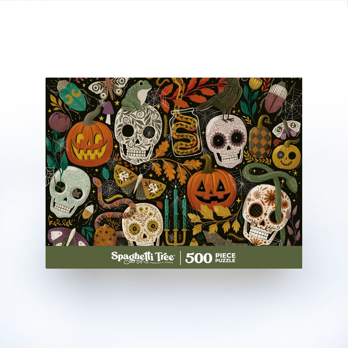 The Creepy Crawlies 500 Piece Jigsaw Puzzle by Spaghetti Tree features a colorful Halloween-themed illustration with skulls, pumpkins, candles, a crow, and various decorative motifs. This randomly cut puzzle offers a delightful challenge for puzzle enthusiasts and spooky season fans alike.