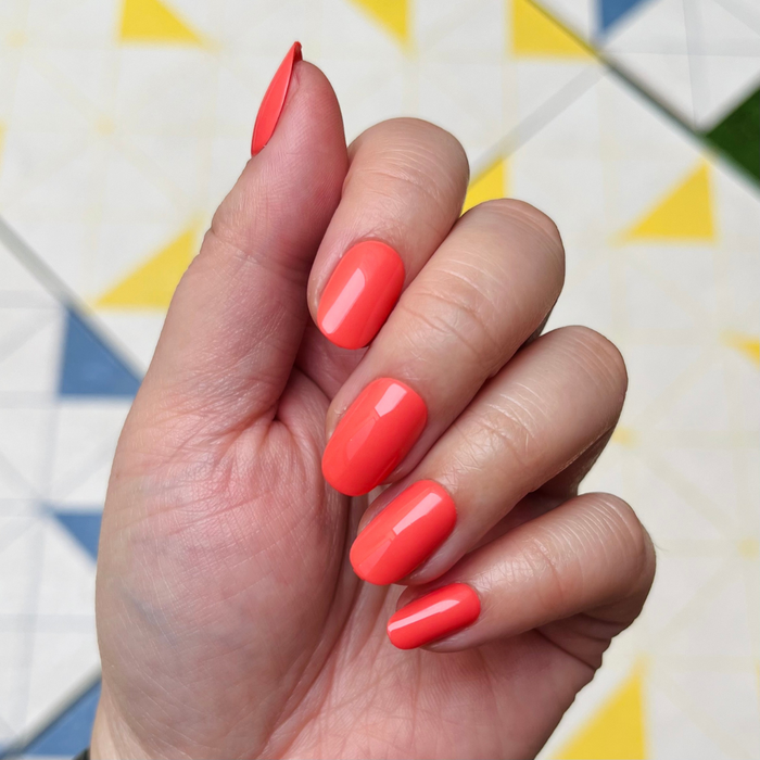 Perfect Pinwheel | Short | Round - Tab Press-On nails in vibrant coral for easy, quick at-home mani with smooth finish