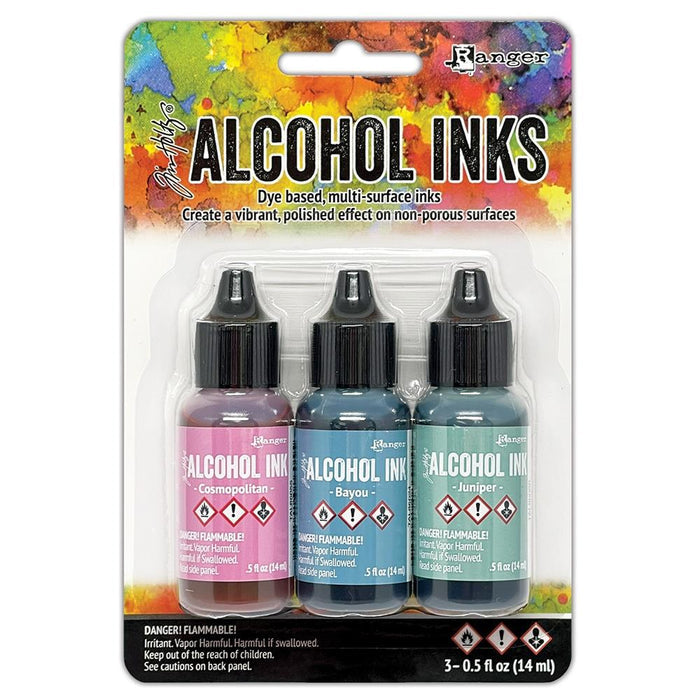 Tim Holtz - Alcohol Ink .5oz - 3/Pkg - Select from Drop Down. The alcohol inks by Ranger are dye based, multi-surface inks. They are acid free, permanent, quick drying and transparent. Available at Embellish Away located in Bowmanville Ontario. Getaway-Cosmopolitan/Bayou/Juniper
