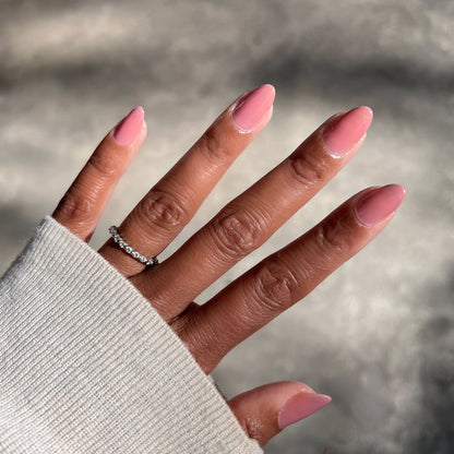 Hand with medium brown skin tone showing glossy Can I Borrow A Sweater? gel polish manicure in natural light