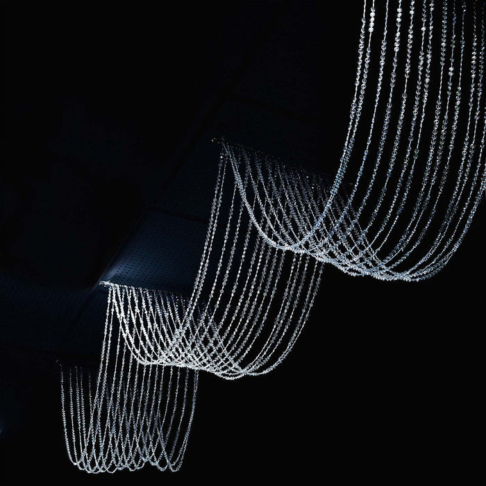 Elegant crystal chandelier with cascading strands of light.