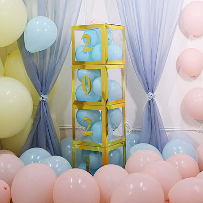 Gold balloon tower with blue and pink balloons, surrounded by pastel balloons.