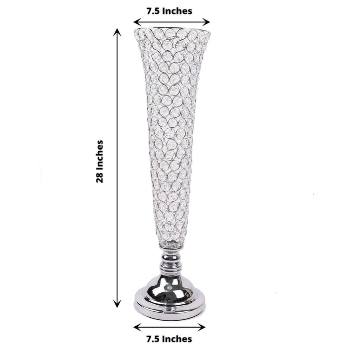 Crystal vase with silver base, 28 inches tall, 7.5 inches wide.