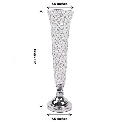 Crystal vase with silver base, 28 inches tall, 7.5 inches wide.