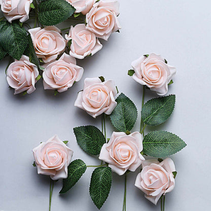 Pink artificial roses with green leaves on a white background.