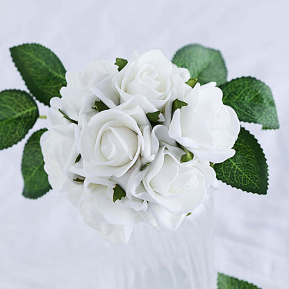 Artificial white rose bouquet with green leaves on a plain background