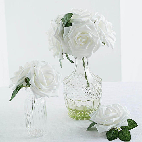 White rose bouquet in glass vases on a light background.