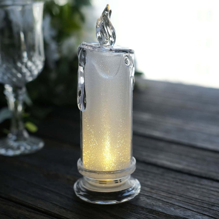 Elegant glass candle holder with soft glowing light.
