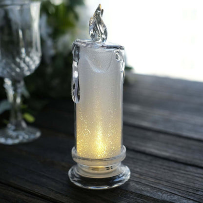Elegant glass candle holder with soft glowing light.