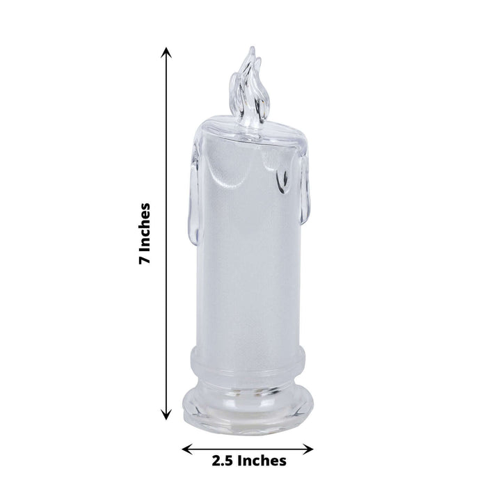 Clear glass candle holder with flame design, 7 inches tall and 2.5 inches wide.