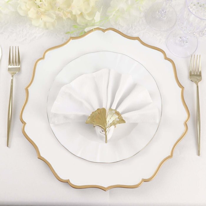 Elegant dining plate set with a gold-accented napkin holder.