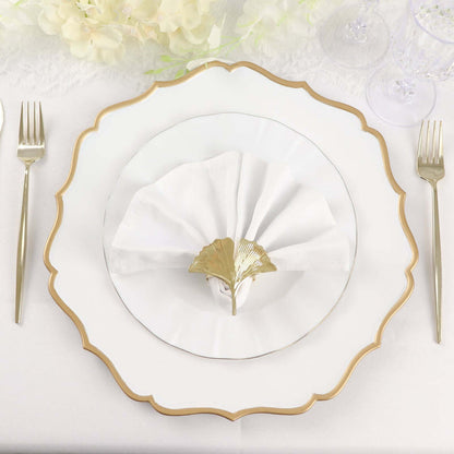 Elegant dining plate set with a gold-accented napkin holder.