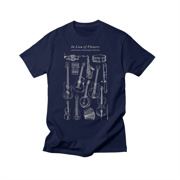 Navy blue T-shirt by Aaron West and the Roaring Twenties featuring exclusive white line illustrations of musical instruments and the text In Lieu Of Flowers and Other Worthy Headstone Twiddles above the artwork.