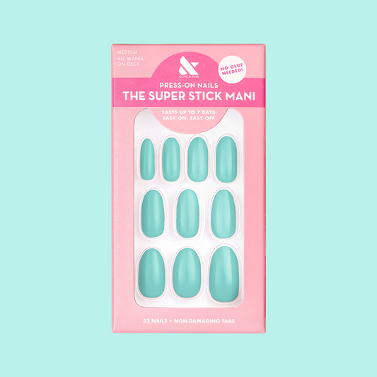 All Manis on Deck | Medium | Oval - Tab Press-On nails in bright blue-green shown in packaging on pastel background