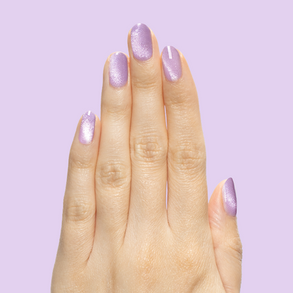 Hand with nails polished in Amethyst Velvet - Gel pastel lavender magnetic polish for at-home manicure look