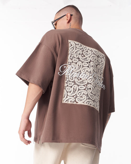 Martin Valen brown T‑shirt with 3D applique lace panel, rear three‑quarter view close‑up showing square lace