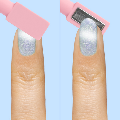 Close-up of finger with Aqua Velvet - Gel pastel blue magnetic gel polish showing velvet effect applied with wand tool on light blue background