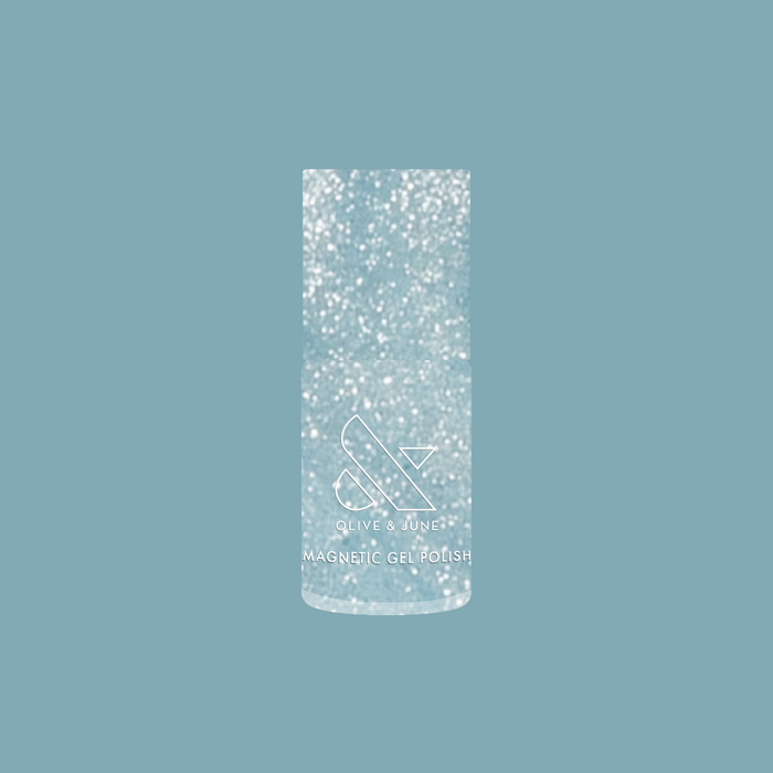 Olive and June Aqua Velvet - Gel magnetic gel polish bottle with shimmering bright pastel blue polish background