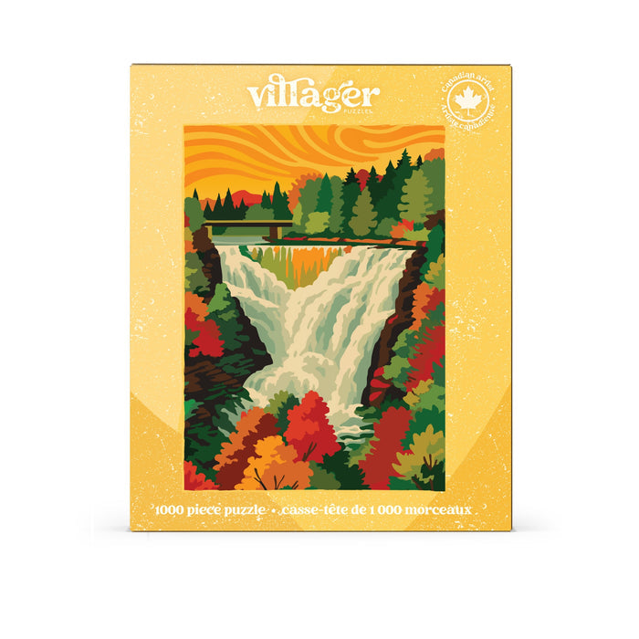 Autumn Cascade | 1,000 Piece Jigsaw Puzzle by Villager Puzzles features an illustrated scene of Kakabeka Falls, with a forest and bridge under an orange sky. The box showcases text in English and French, a maple leaf symbol in the top right corner, and stunning autumn foliage inspired by Canadian art.