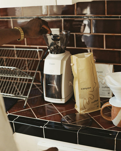 Baratza Encore Burr Grinder with Canyon Coffee in the kitchen with a bag of Alentejo coffee by Canyon