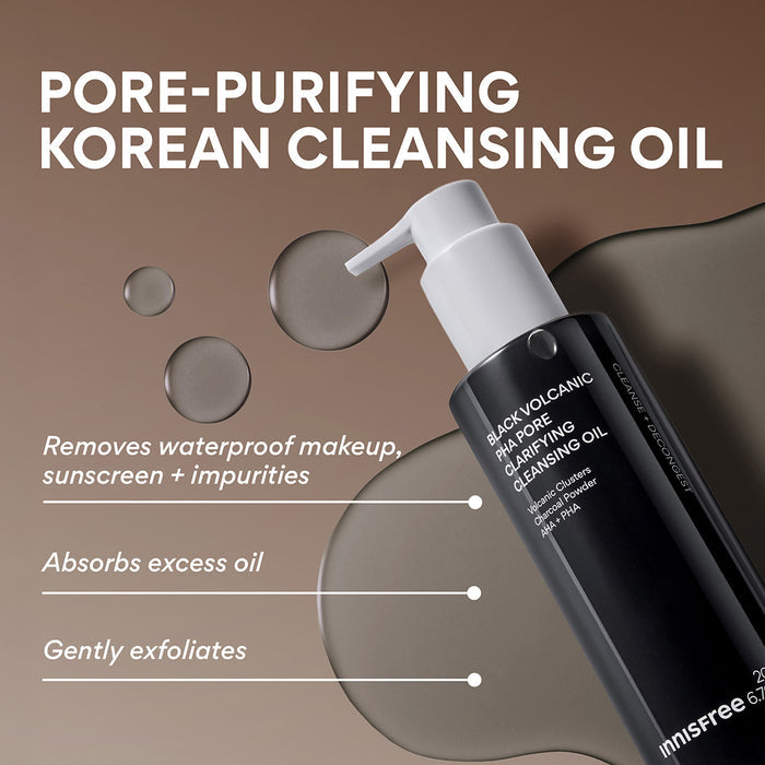 A bottle of Innfree Black Volcanic Pore Purifying Cleansing Oil shown on a warm brown background with text callouts about removing waterproof makeup, sunscreen, and impurities, plus oil droplets in the scene.