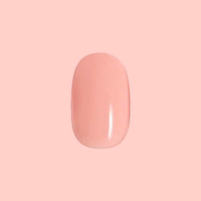 Single short round nail in soft floral pink shade from Carnation | Short | Round - Tab Press-On for an easy at-home mani