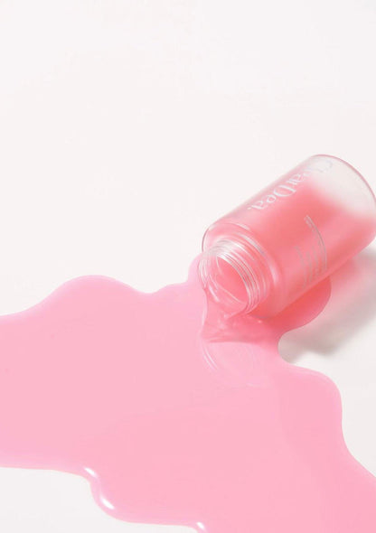Pink lip balm with a visible brand name on a white background