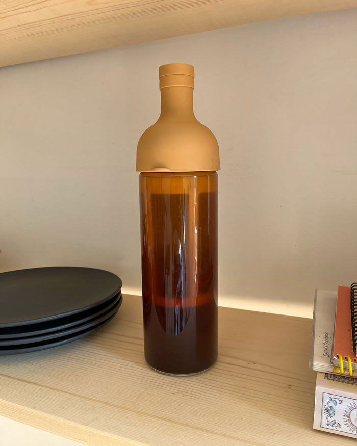 A bottle for brewing cold brew coffee by Hario filled with Canyon Coffee