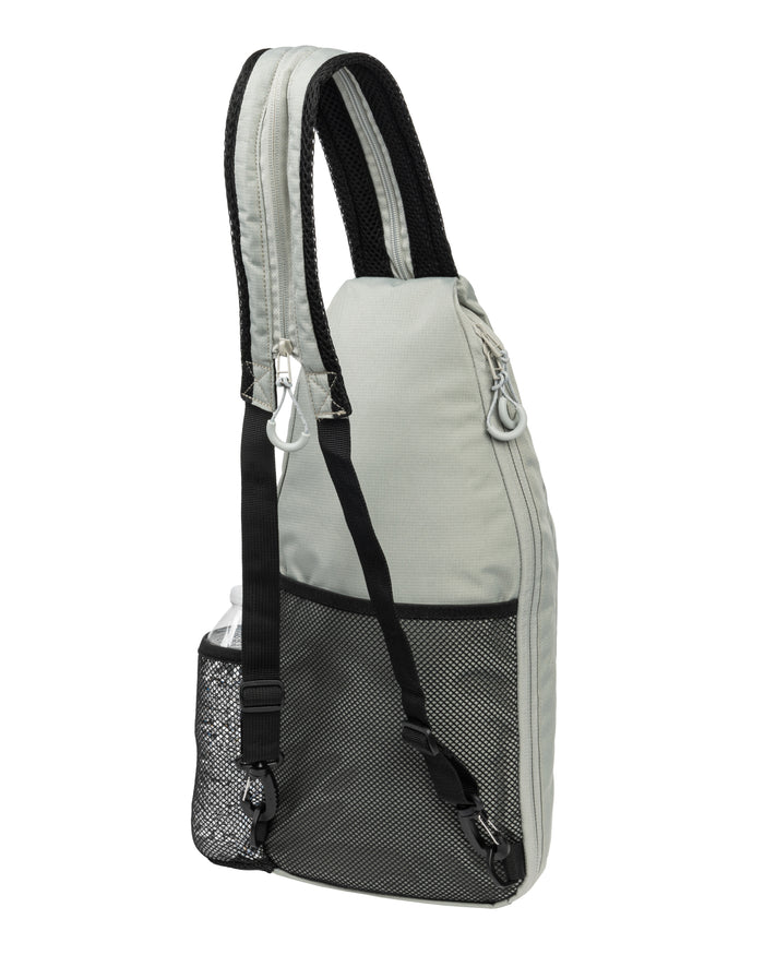 Side view of Core Line Pickleball Sling Bag in gray with padded shoulder strap, mesh water bottle pocket, and top zipper