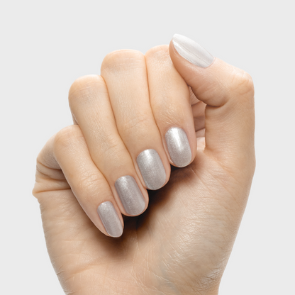 Cosmic Silver - Gel metallic silver gel polish on short natural nails by Olive and June for a shiny manicure