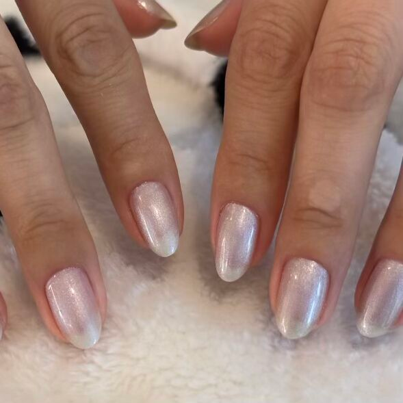 Cosmic Silver - Gel shimmery metallic silver gel polish on short natural rounded nails by Olive and June