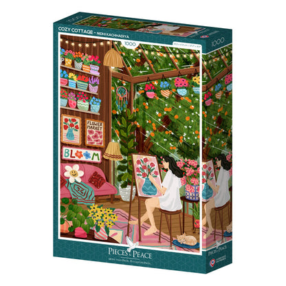 A 1,000-piece jigsaw puzzle by Pieces & Peace, titled "Cozy Cottage," features artwork by Nidhi Kachhadiya depicting a woman painting flowers in a warm, plant-filled cottage surrounded by colorful art supplies and flower-themed decorations. Made in France.