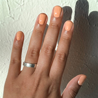 CS - Gel shown on natural nails in a smooth, petal-soft peach coral shade for a fresh at-home manicure look