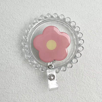 Daisy Retractable Badge Reel - Pink with Yellow Centre