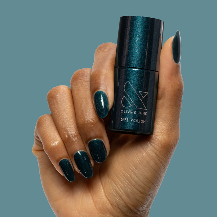 Dancing Green - Gel deep emerald green chrome gel polish on neatly shaped nails by Olive and June