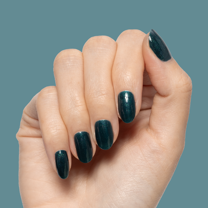 Dancing Green - Gel deep emerald chrome gel polish manicure on short, rounded nails by Olive and June
