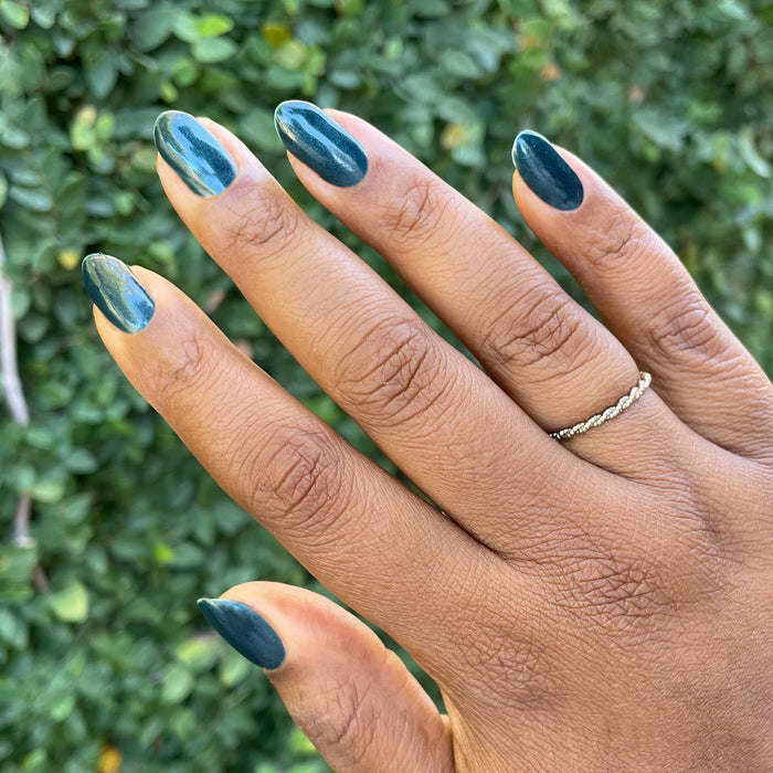 Dancing Green - Gel deep emerald green chrome gel polish manicure on medium-length oval nails by Olive and June
