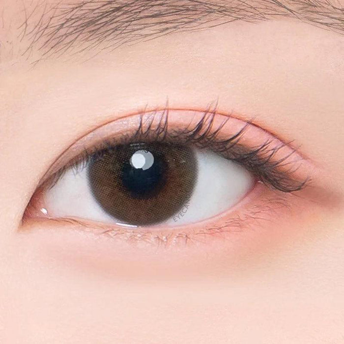Macro shot of an eye wearing the DooNoon Ppeum 1-Day Grey (10pk) prescription colour contact lens, showing the multi-colored detail and natural effect on dark brown eyes.
