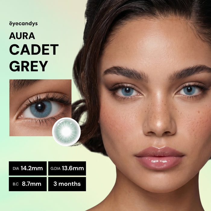 A close-up of a woman wearing EyeCandys Aura Cadet Grey contacts, with an inset of her eye and details: diameter 14.2mm, graphic diameter 13.6mm, base curve 8.7mm, lasts 3 months.