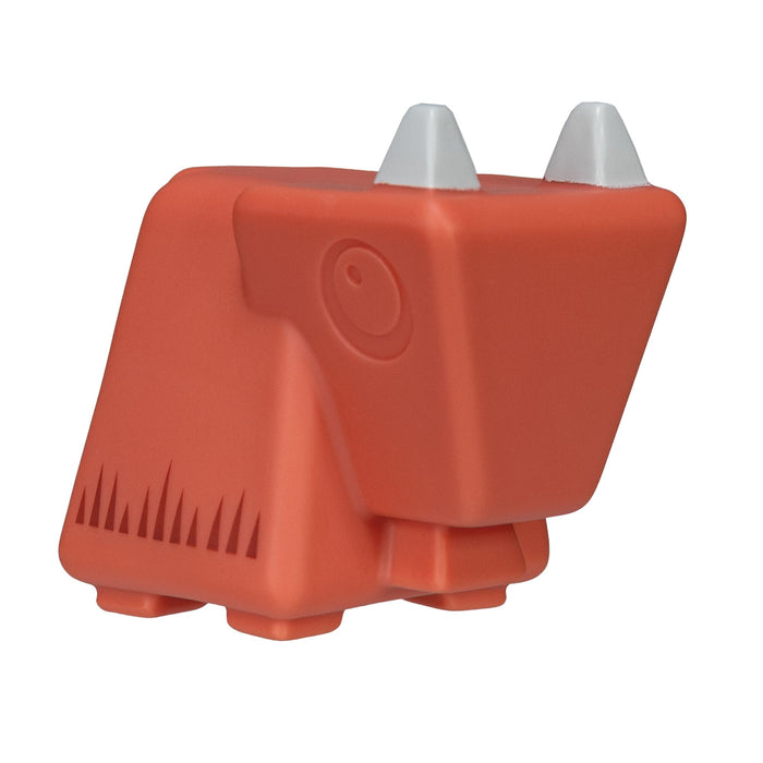 Introducing Farm Animal Bath Toys: a small, red, geometric toy shaped like a farm animal, complete with two white, cone-shaped horns and four stubby legs. Its simple, abstract design features triangular markings on the side—perfect for babies to stack with other Farm Animal Bath Toys or enjoy as a fun bath companion.
