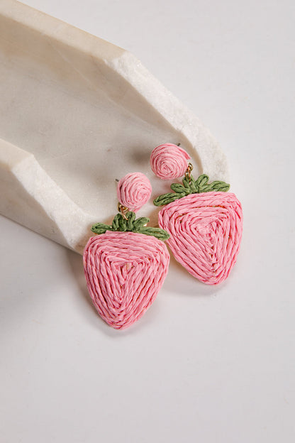 Pink strawberry-shaped earrings on a white background