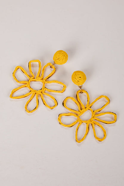 Yellow flower-shaped earrings on a light gray background