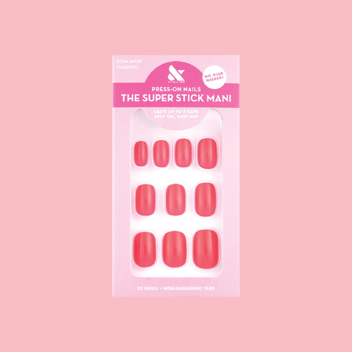 Flamingo | Extra Short | Squoval - Tab Press-On nails in neon pink shade on packaging against soft pink background