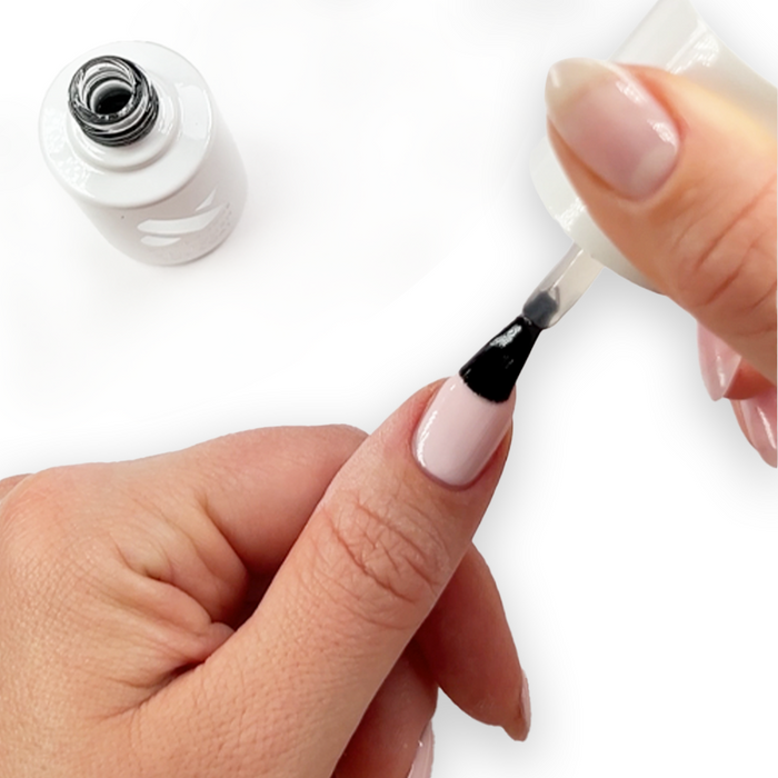 Applying Gel Top Coat on natural nail for a glossy, long-lasting manicure with smooth gel polish finish at home