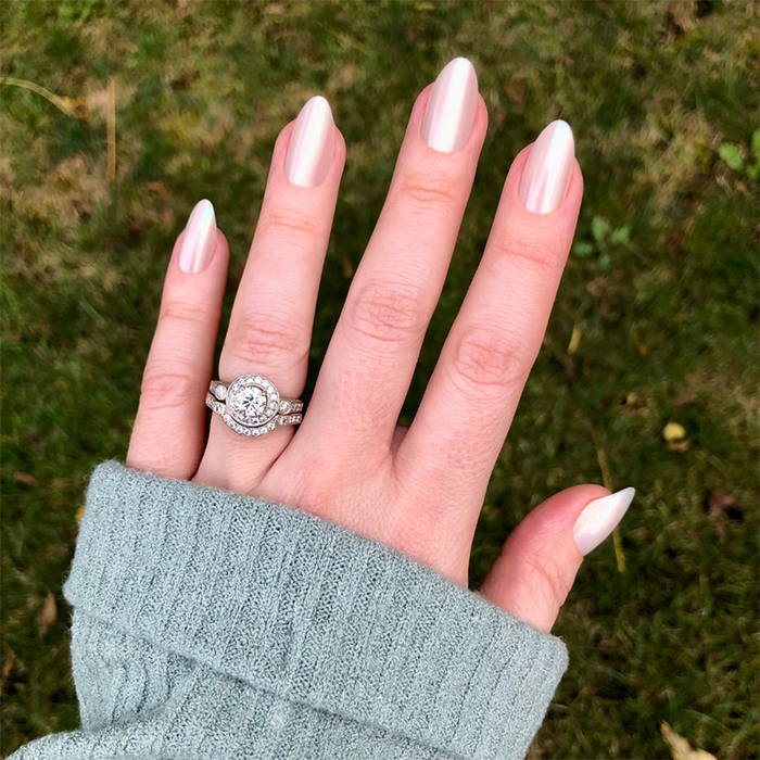 Girl With The Pearl Nail Polish - Press On | Medium | Almond iridescent sheer manicure on hand outdoors with green grass background