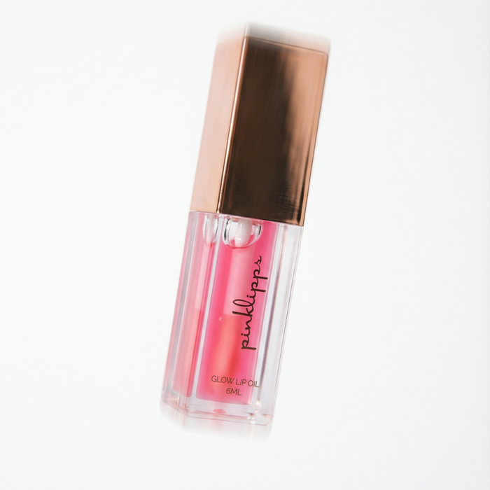 Pink Lipps 'Blossom' Glow Lip Oil tube on white background, strawberry scent vegan high-shine pink lip oil for every shade of melanin.