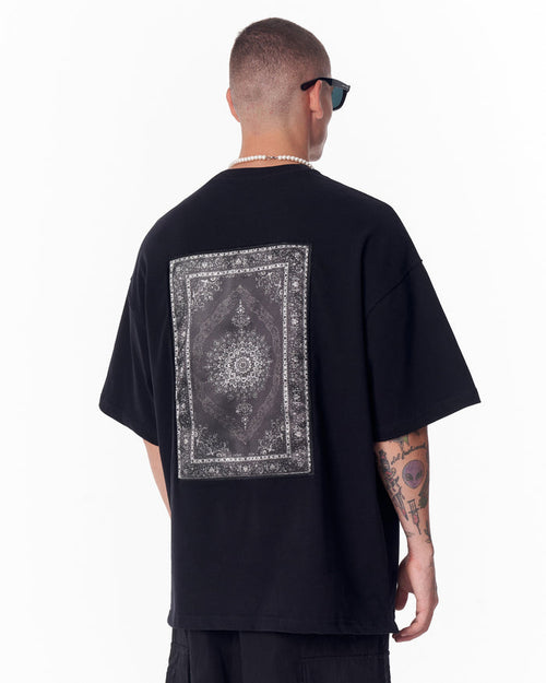 Martin Valen Gothic Depth black oversized T-shirt seen from back, large rectangular applique patch printed on center
