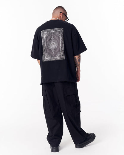 Martin Valen Gothic Depth black oversized T-shirt three-quarter back view, decorative applique patch centered on back