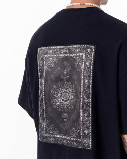 Martin Valen black oversized T‑shirt rear centered view showing rectangular gothic printed applique patch