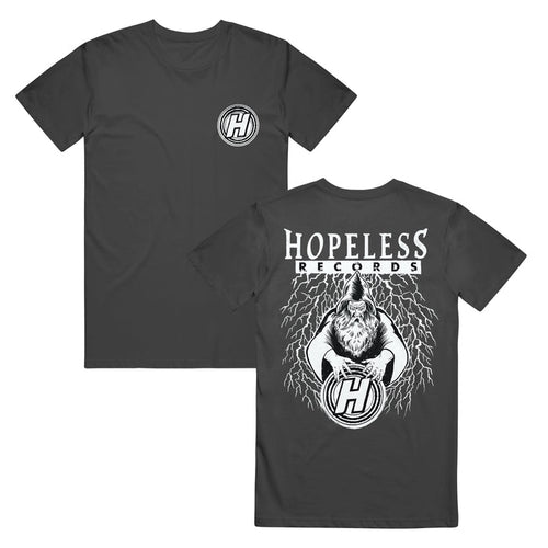 Hopeless Records black Shakawear t-shirt with a small H logo on the front left chest. The back shows Hopeless Records text above an illustrated howling wolf with lightning, gripping a large H logo.